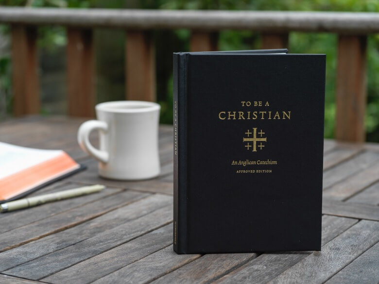 To Be a Christian book cover on wooden table